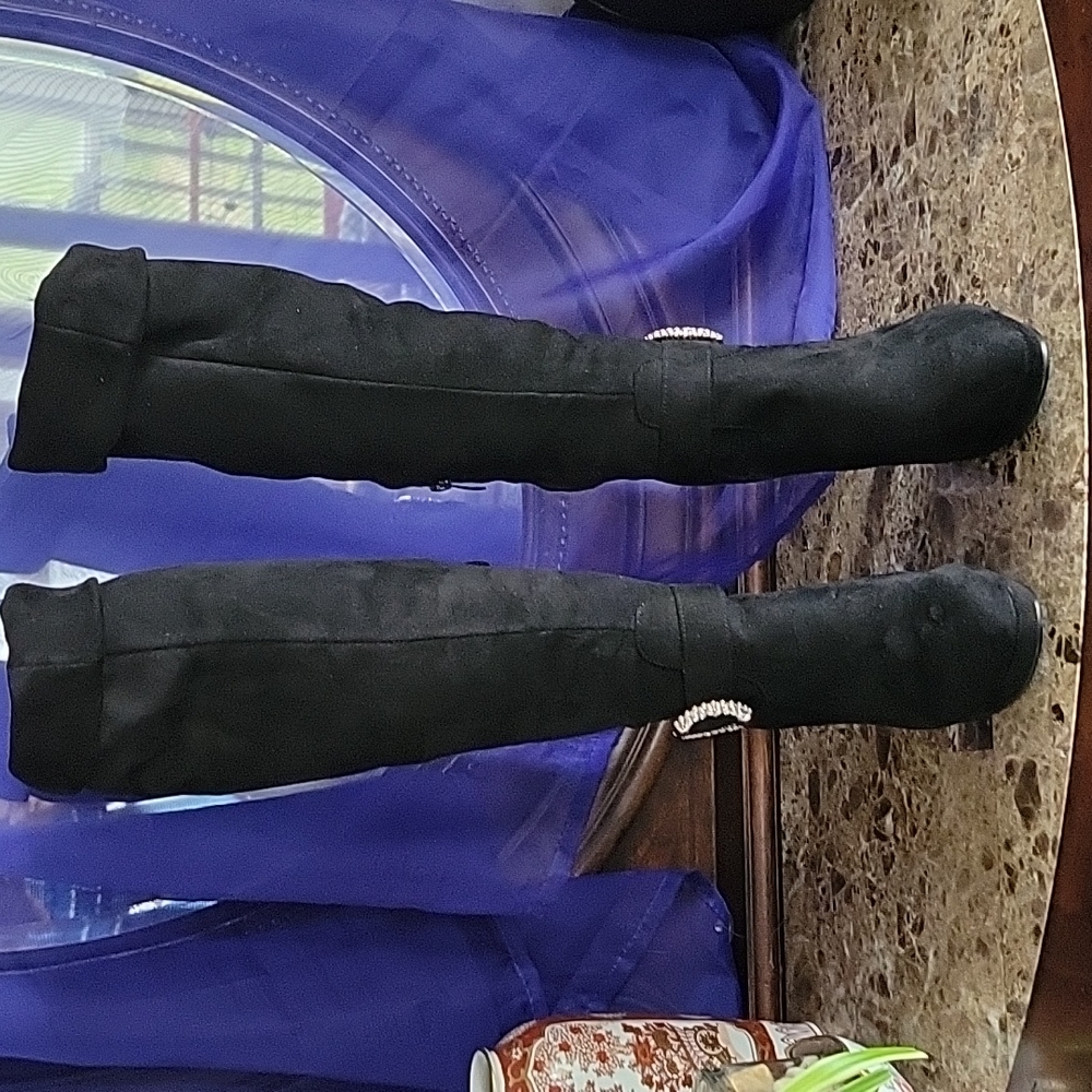 Woman's fashion high heel boots. Size 10. In gently used condition.